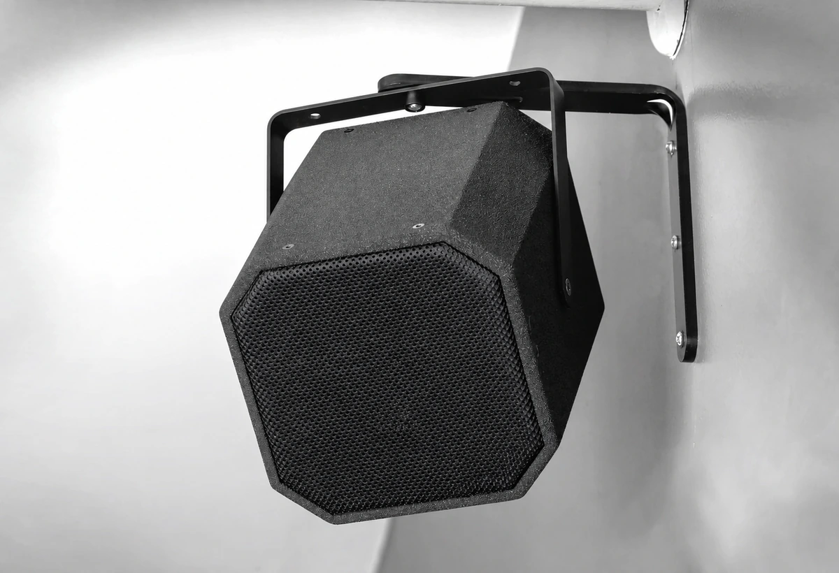 Professional loudspeaker installed with a custom metal yoke mounting bracket